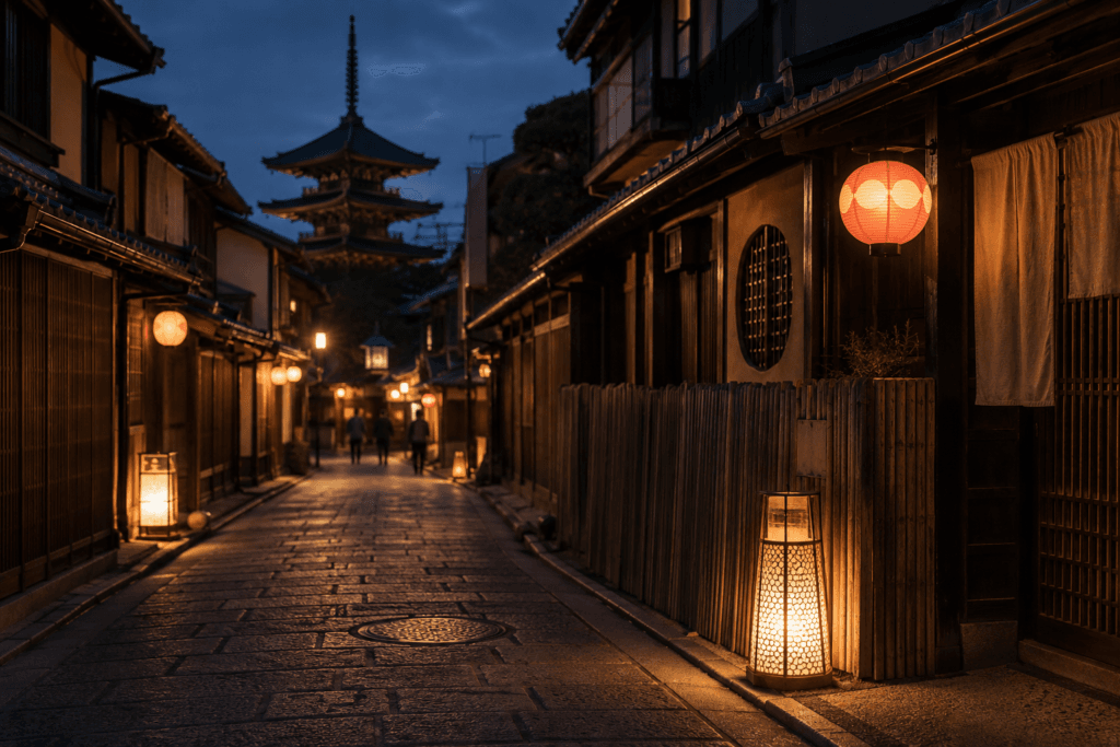 Quiet Gion evening street in Kyoto with warm lanterns, traditional wooden buildings, stone pavement and distant walking silhouettes