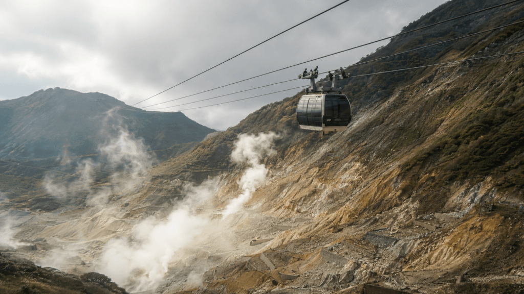 Hakone Ropeway traveling above the volcanic landscape of Owakudani