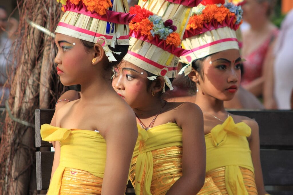 Young Balinese festival participants in traditional performance dress in Bali in 2010