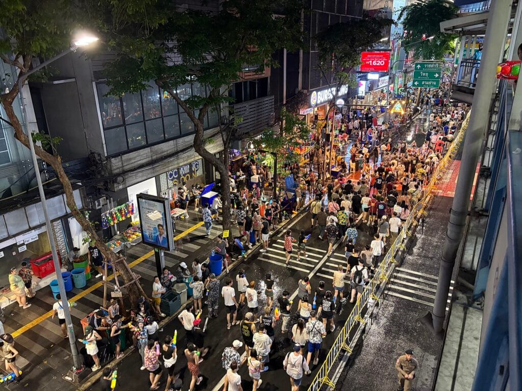 Crowds taking part in Songkran water celebrations on Silom Road in Bangkok in April 2025