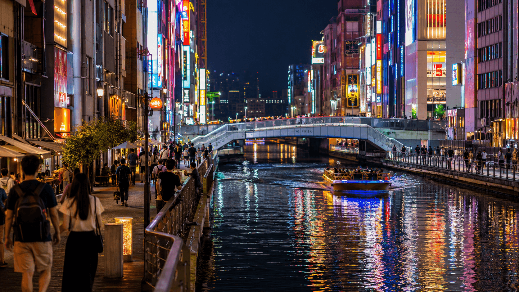 Dotonbori-style Osaka night canal with neon reflections, riverside walkways, bridges, travelers and a sightseeing boat