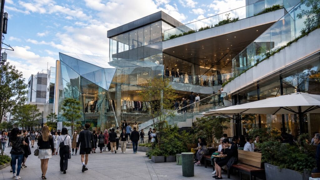 Modern Harajuku fashion shopping complex with glass architecture, terraces and visitors