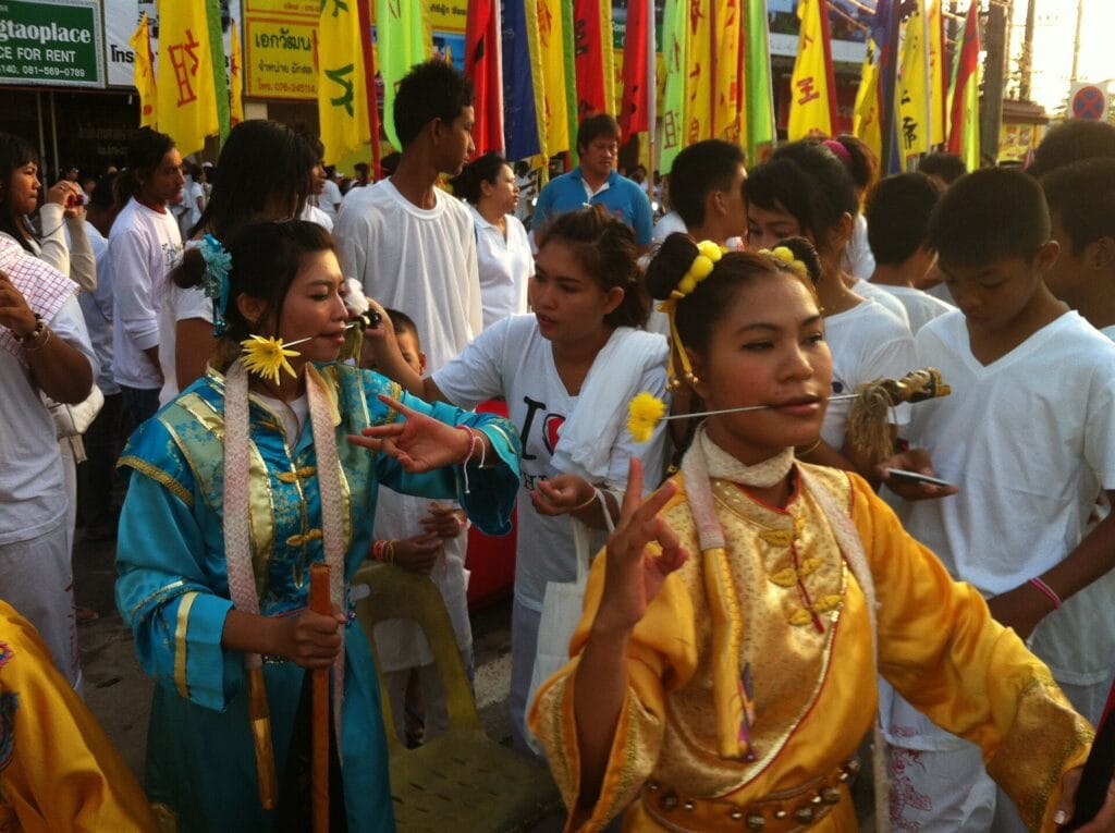 Female Mah Song participants and devotees preparing for a morning parade in western Phuket in 2012