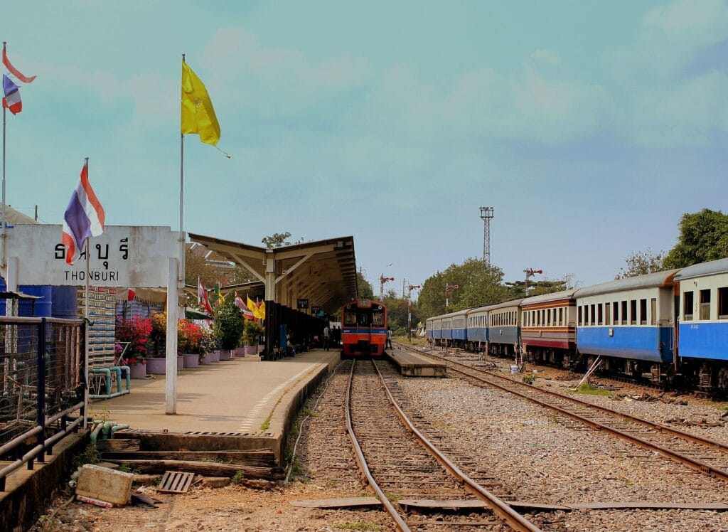 Passenger trains waiting beside the platforms at Thonburi Railway Station in Thailand