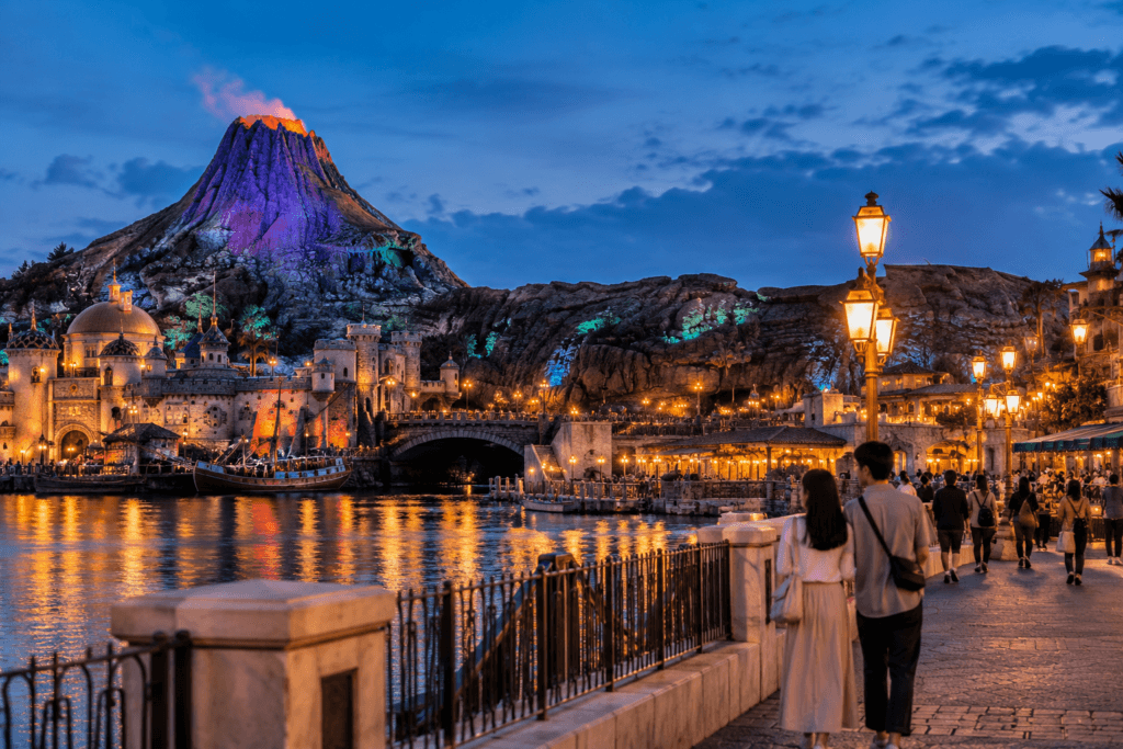 Seaside fantasy theme park near Tokyo with water, volcano views and evening lights